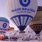 Hot air balloons over Cappadocia on a snowy day Nazar Balloons